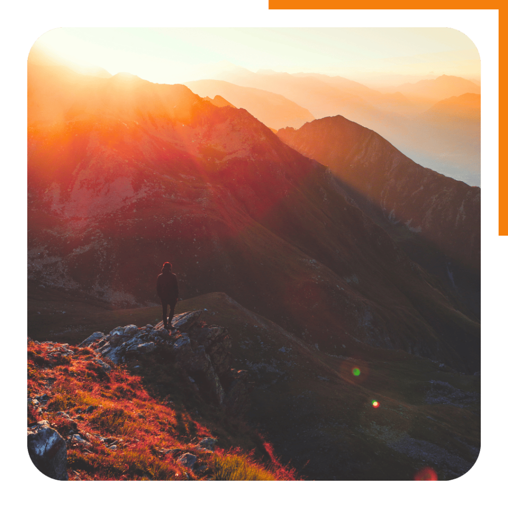 Going for a motivational walk on a mountain ridge at sunrise.